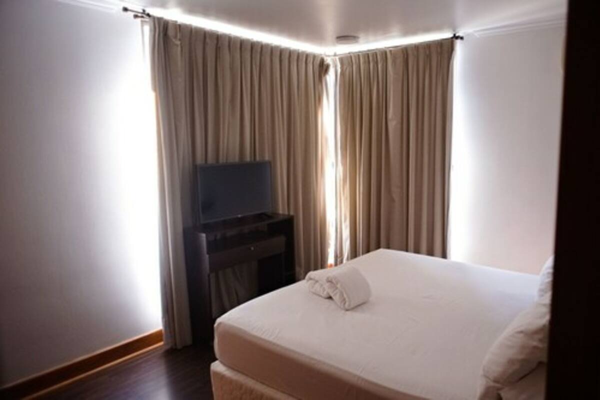 Premium bedding, down duvets, in-room safe, desk