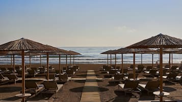 On the beach, sun-loungers, beach umbrellas