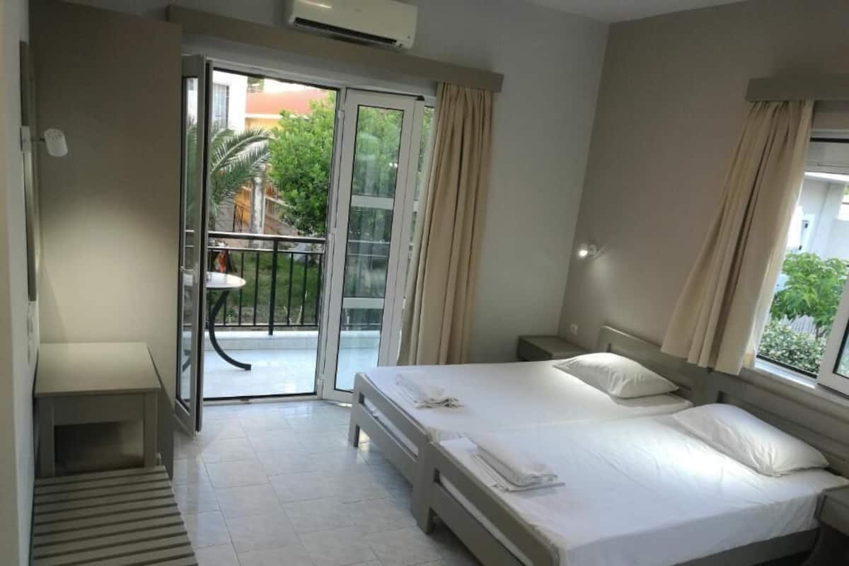 Basic Triple Room, Balcony (For 3) | Egyptian cotton sheets, in-room safe, desk, blackout drapes