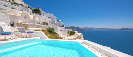 Seasonal outdoor pool, open 11:00 AM to 9:30 PM, pool umbrellas