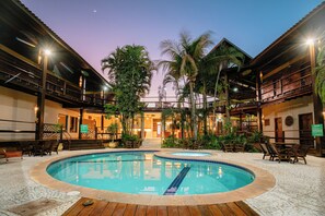 A pool area with two pools, wooden deck, and lounge chairs. - Hotel Pirá Miúna (Bonito)