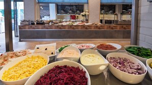 A buffet with various food items in bowls. - Detelina (Varna)