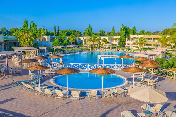 Seasonal outdoor pool, open 10:00 AM to 6:00 PM, pool umbrellas