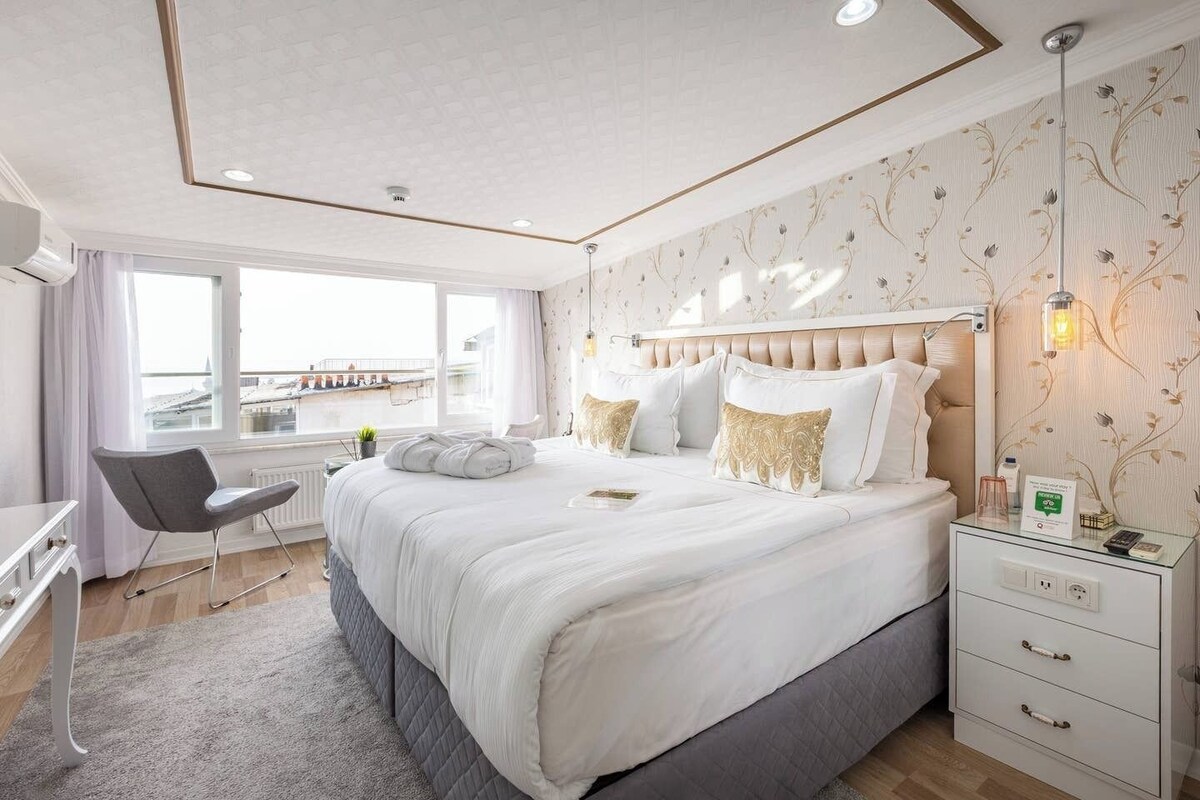 Junior Suite, Multiple Beds, Balcony, Sea View | Minibar, in-room safe, blackout drapes, iron/ironing board (on request)