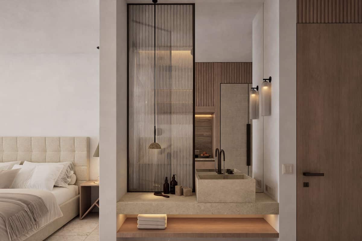 A modern bedroom with a bed, bedside table, and a large mirror.