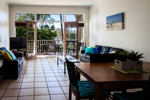 Apartment, 1 Bedroom, River View | Living area | Flat-screen TV - Sandy Beach Resort (Noosaville)
