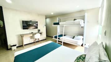 Standard Quadruple Room, Multiple Beds | Minibar, in-room safe, desk, laptop workspace