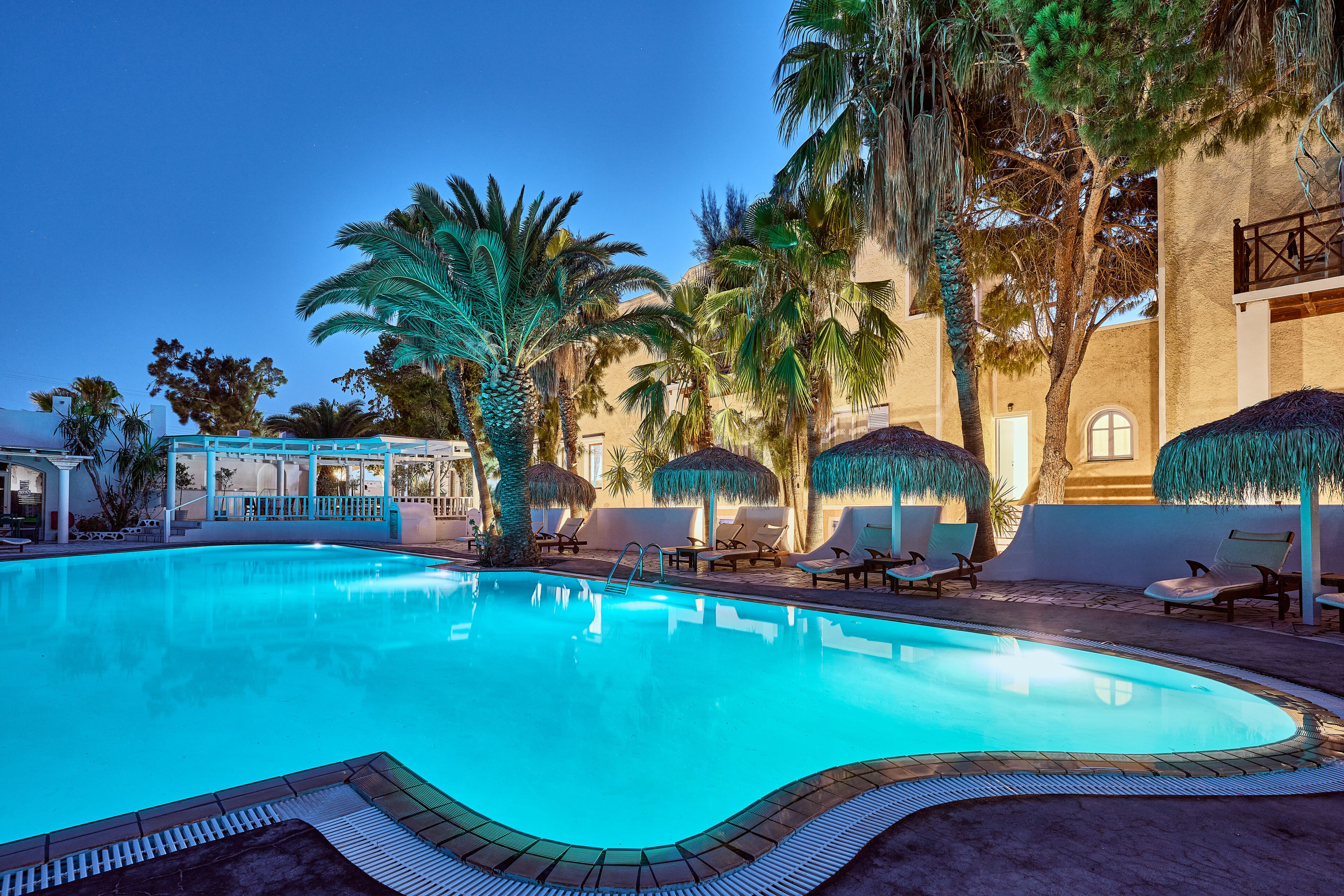 outdoor pool, open 8:00 am to 8:00 pm, pool umbrellas, pool loungers