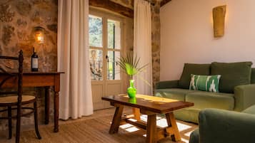 Premium Suite | Down comforters, minibar, in-room safe, individually decorated