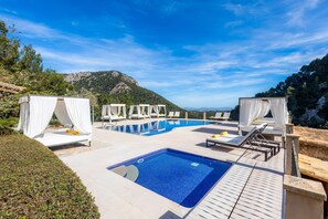 Outdoor pool, pool umbrellas, sun loungers