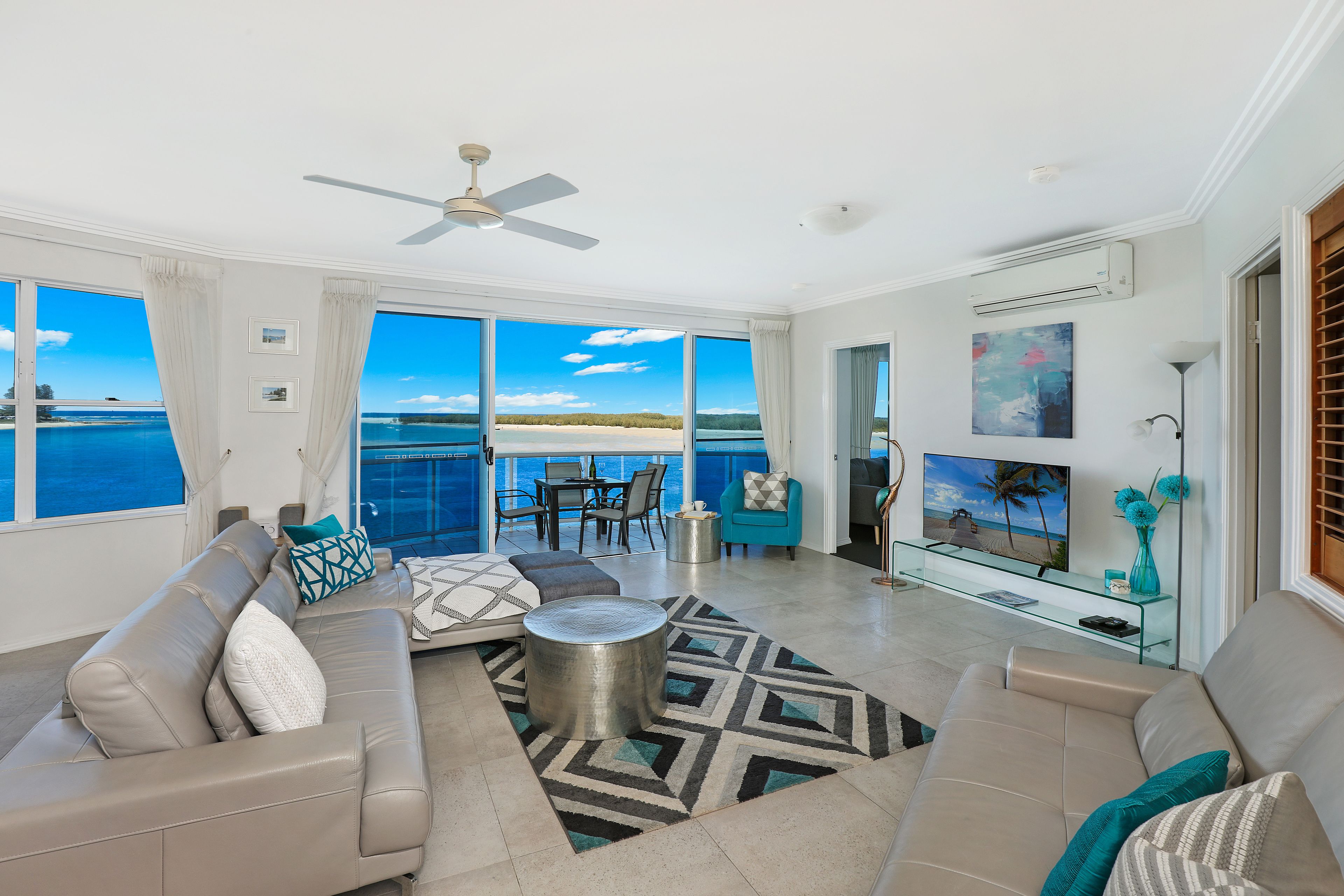 absolute waterfront 2 bedroom penthouse apartment with rooftop and spa  | living area | lcd tv, pay films