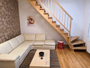 Duplex, 1 Bedroom, Garden Area | Living area | 55-inch flat-screen TV with cable channels, TV - Apartments Tynska 7 (Prague)