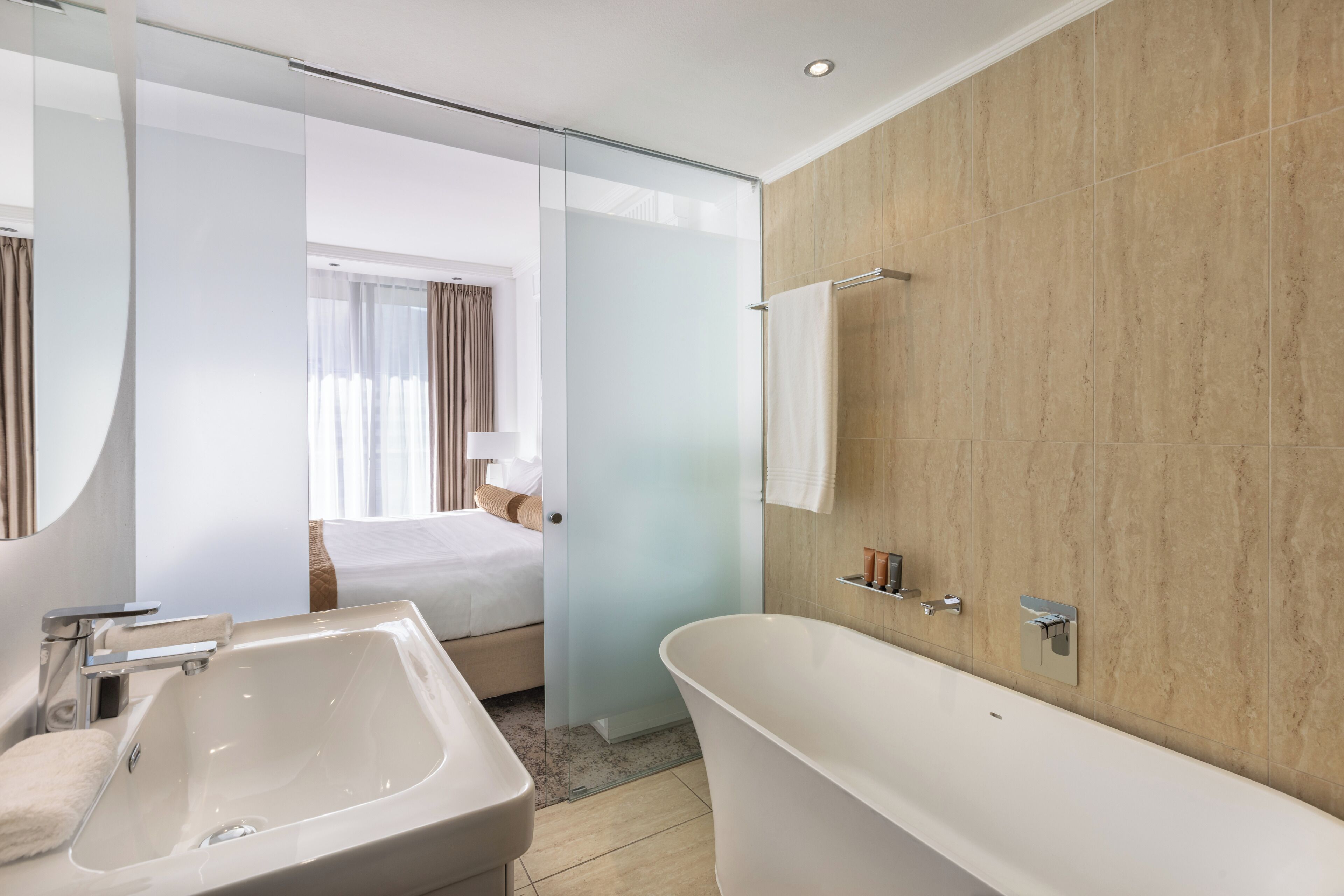deluxe studio, 1 king bed | bathroom | separate bathtub and shower, hydromassage showerhead