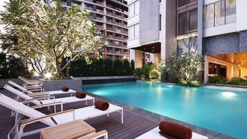 Outdoor pool, open 6:00 AM to 8:00 PM, pool umbrellas, pool loungers