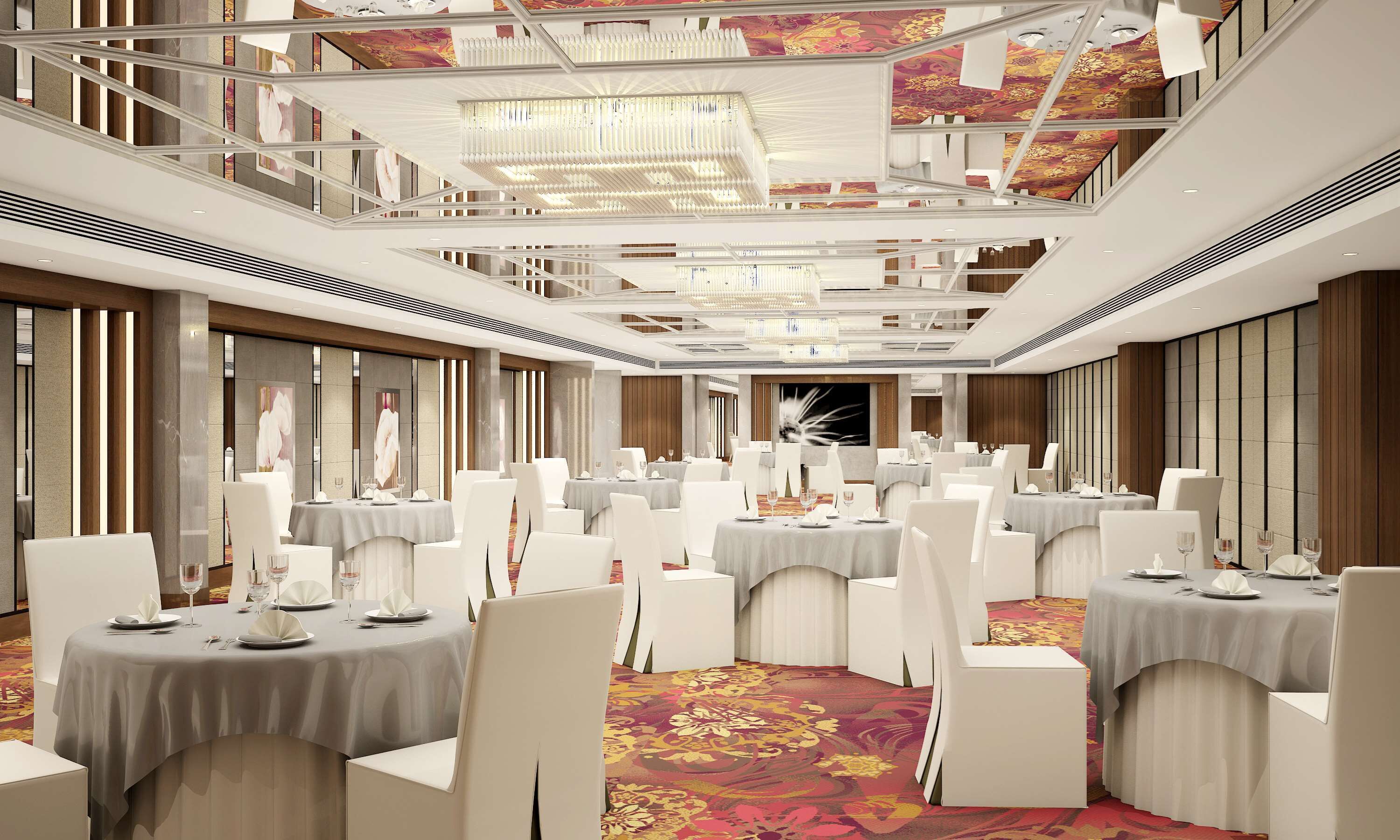 A banquet hall with multiple round tables, white chairs, and a high ceiling with decorative elements.