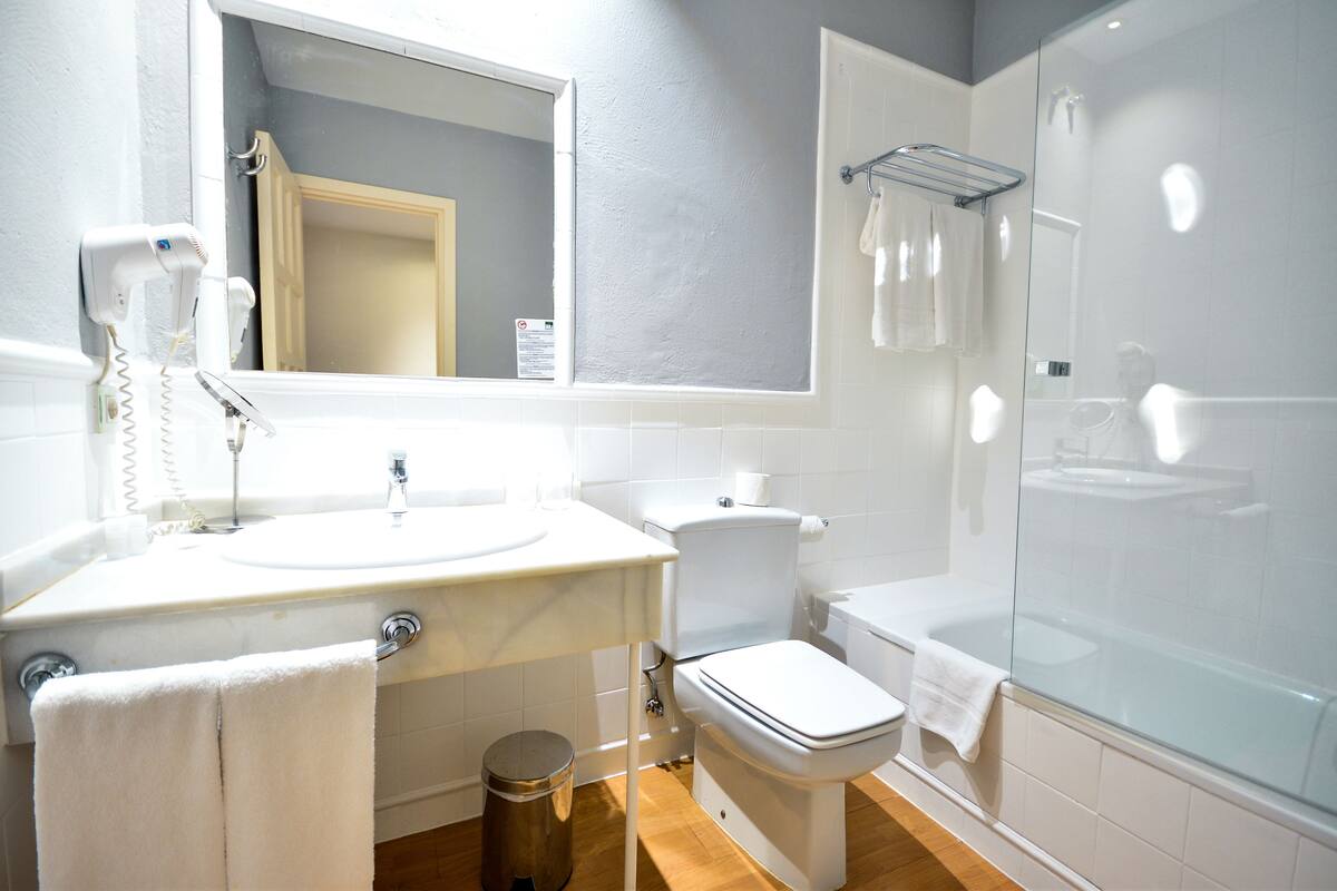 deep-soaking bathtub, rainfall showerhead, free toiletries, hair dryer