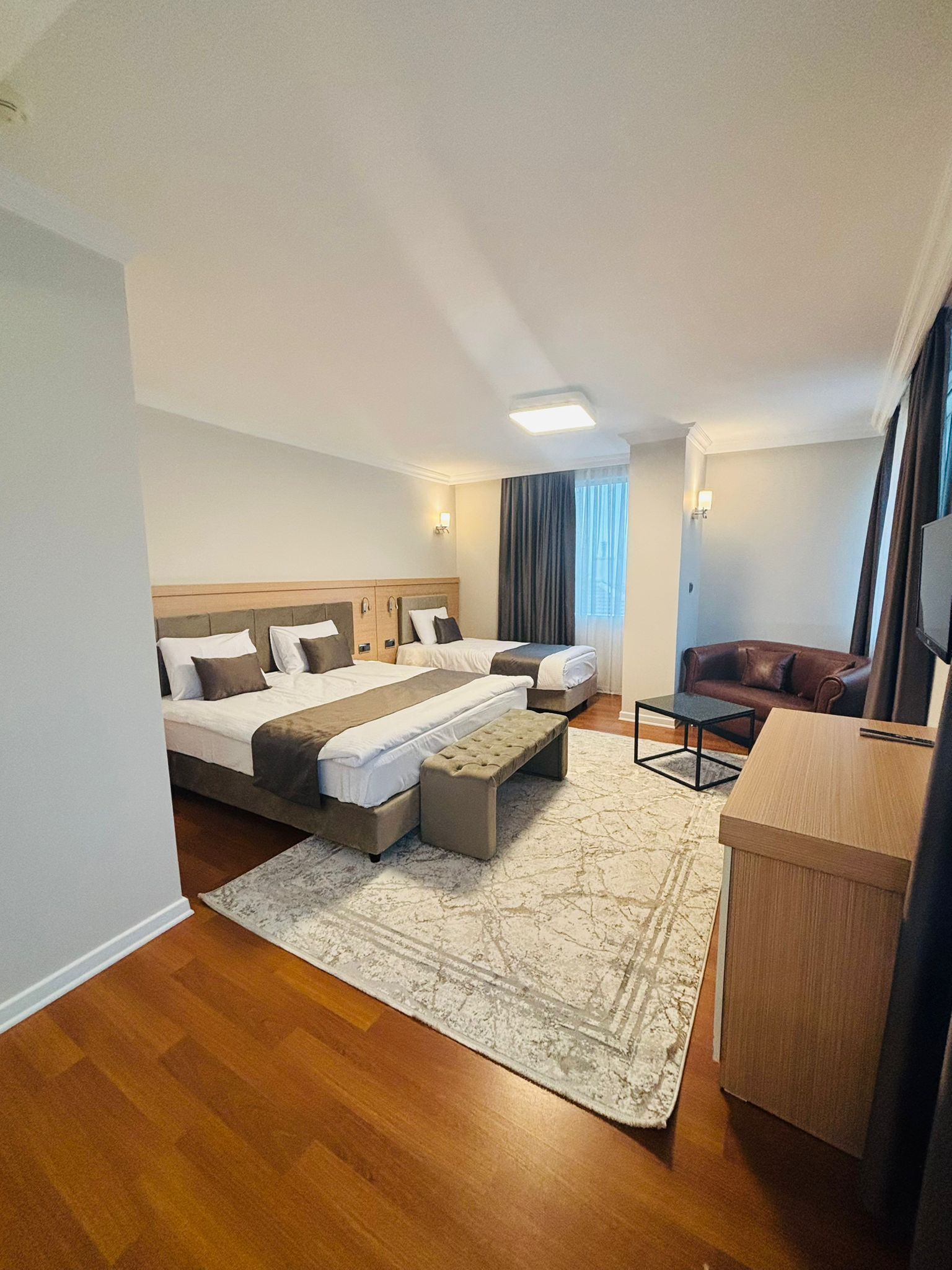 Business Triple Room, Multiple Beds | Minibar, in-room safe, desk, free WiFi