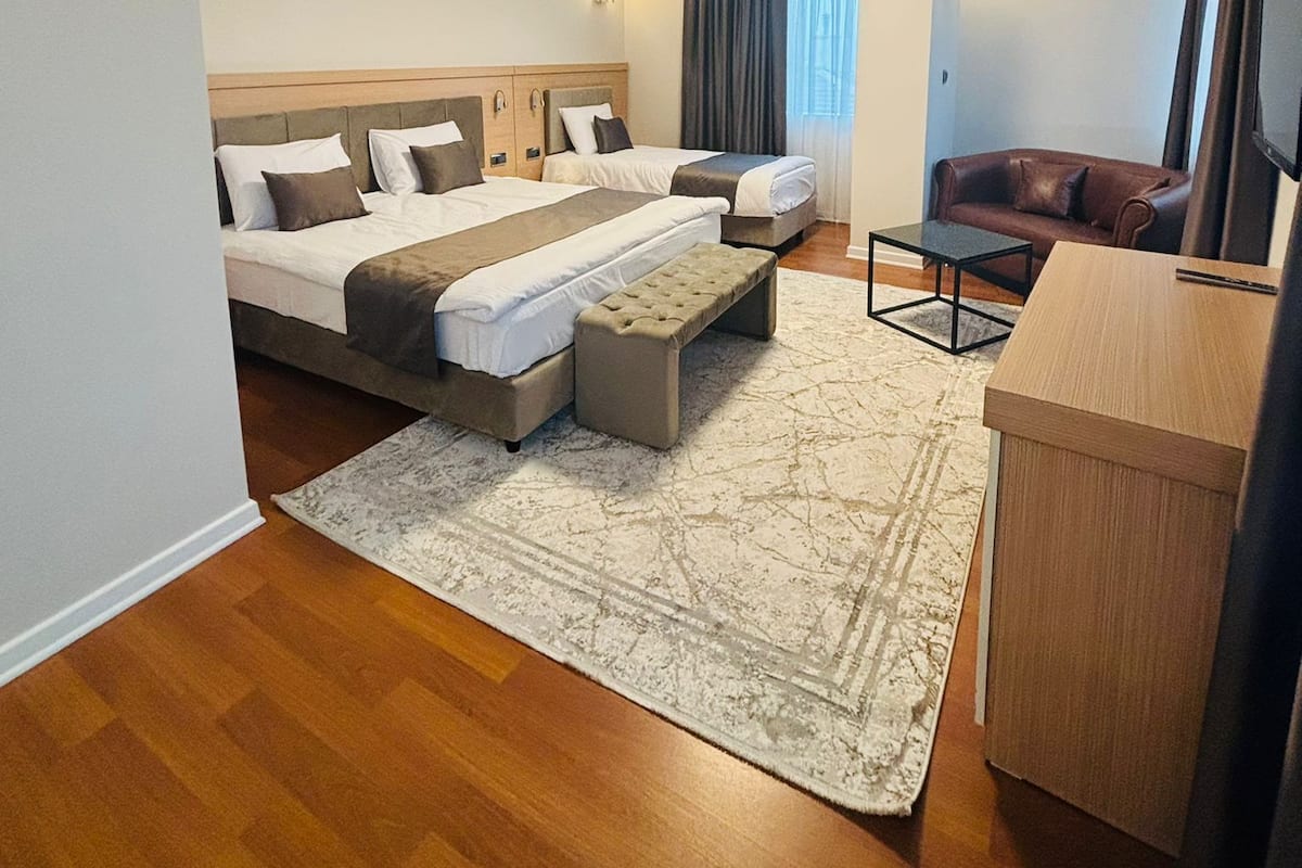 Business Triple Room, Multiple Beds | Minibar, in-room safe, desk, free WiFi