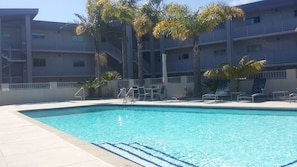 Outdoor pool, pool umbrellas, sun loungers