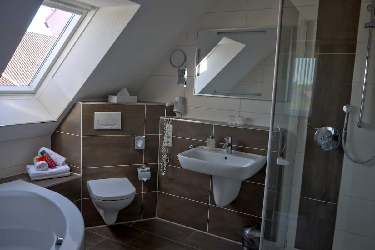 superior double room | bathroom | shower, free toiletries, hair dryer, towels