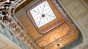 A ceiling with ornate metalwork and a central skylight. - Hotel La Vila (Sóller)