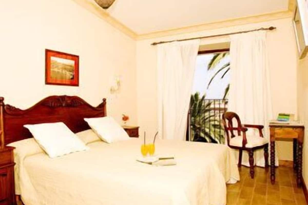 down duvets, memory-foam beds, minibar, in-room safe