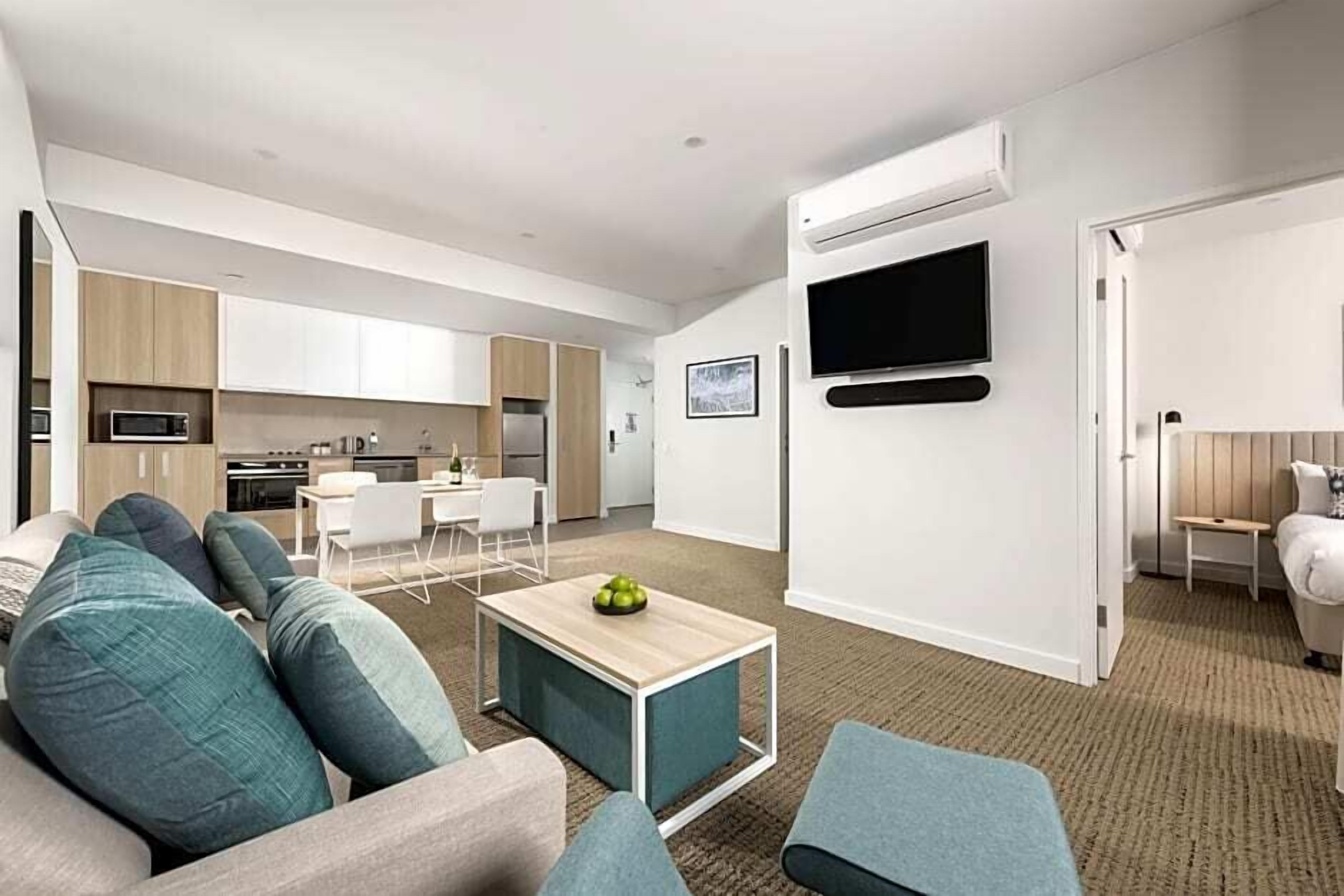 deluxe apartment (1 king bed or 2 single beds) | living area | 32-inch lcd tv with cable channels, tv, dvd player