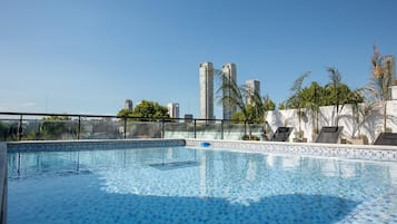 Seasonal outdoor pool, open 9:00 AM to 9:00 PM, pool loungers