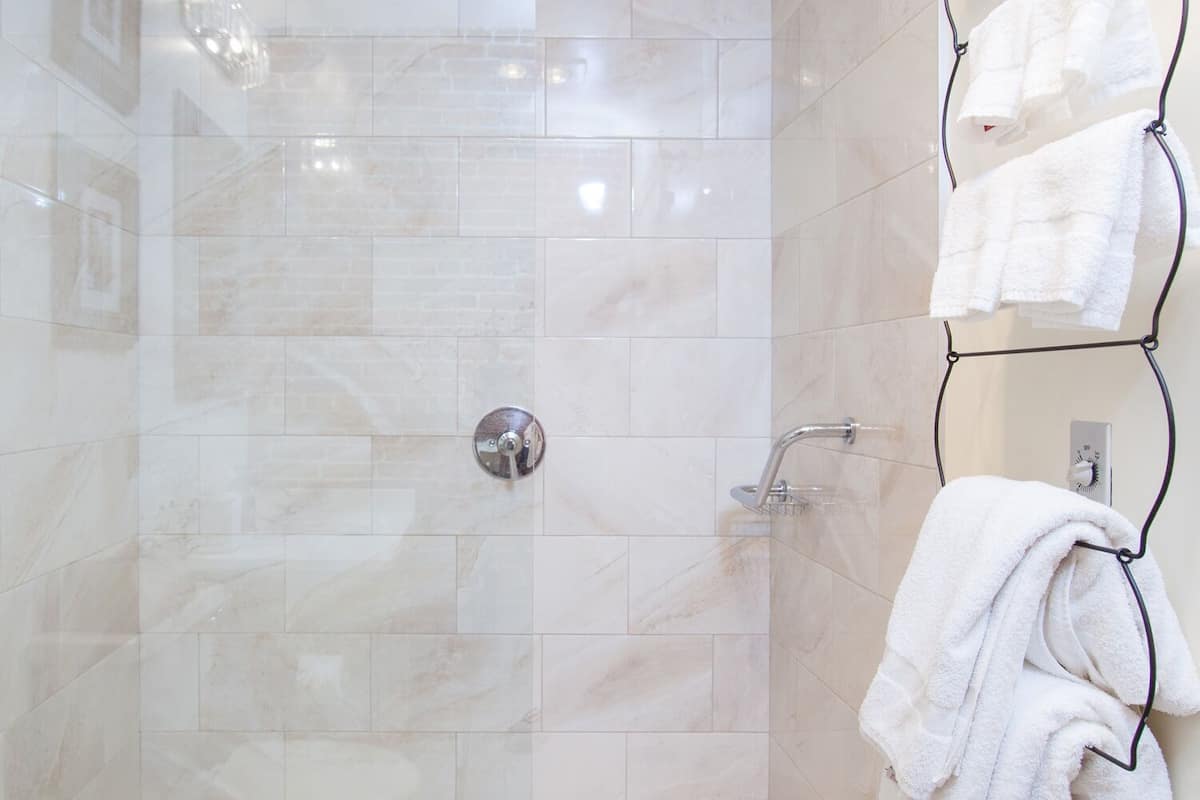 rainfall showerhead, designer toiletries, hair dryer, bathrobes