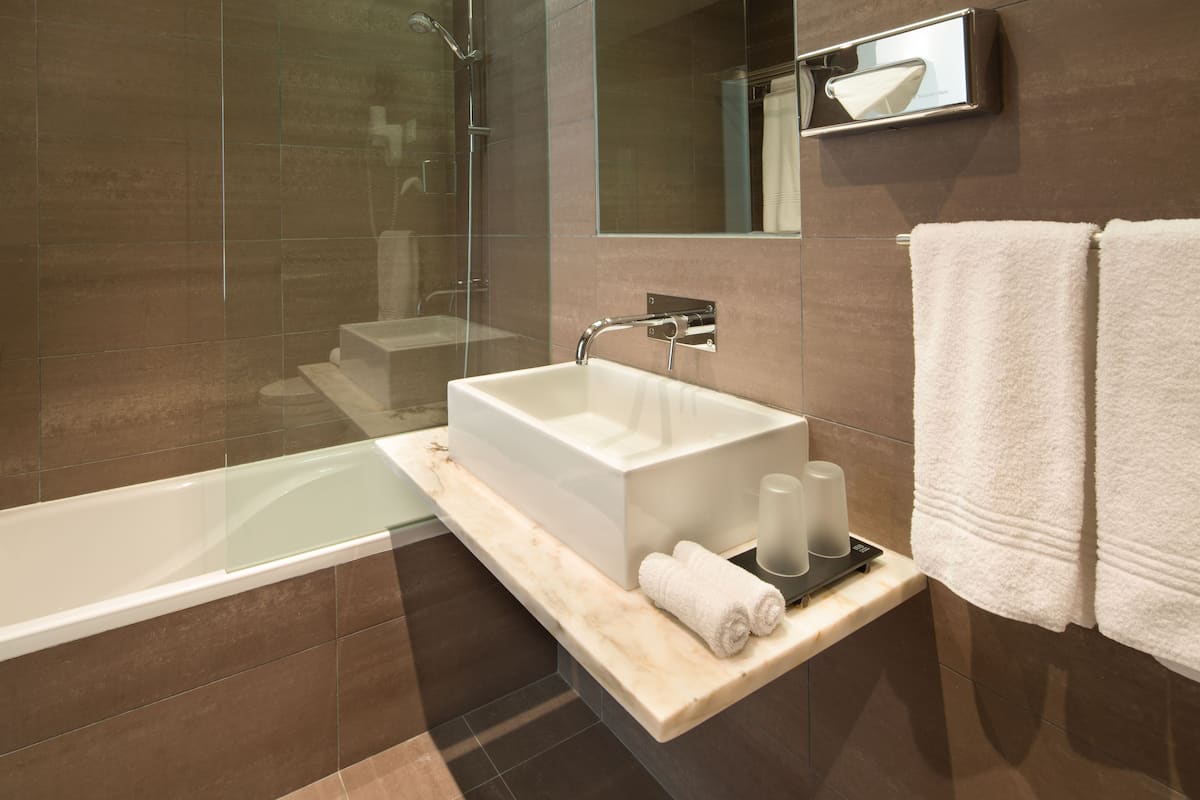 combined shower/bathtub, free toiletries, hair dryer, bathrobes