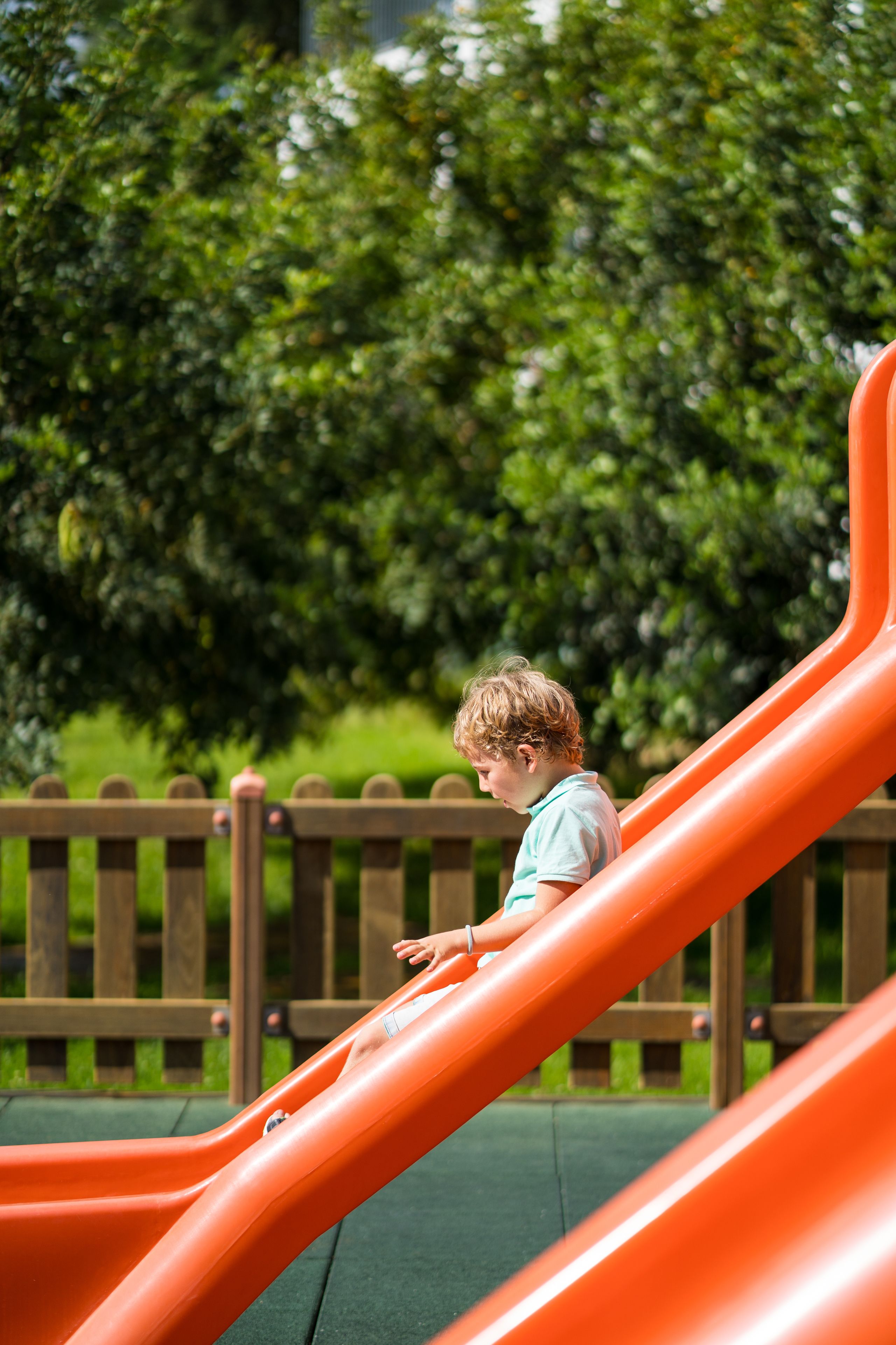 A child on a playground slide.