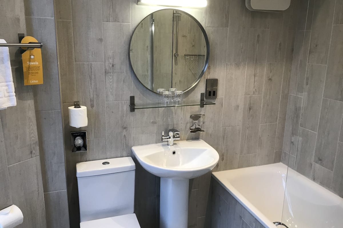 king room with sofa bed | bathroom | shower, free toiletries, hair dryer, towels