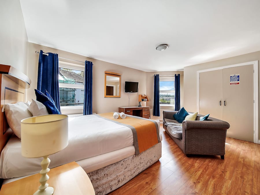 Family Room | Desk, blackout curtains, iron/ironing board, free WiFi