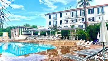 Outdoor pool, open 8 AM to 9 PM, pool umbrellas, pool loungers