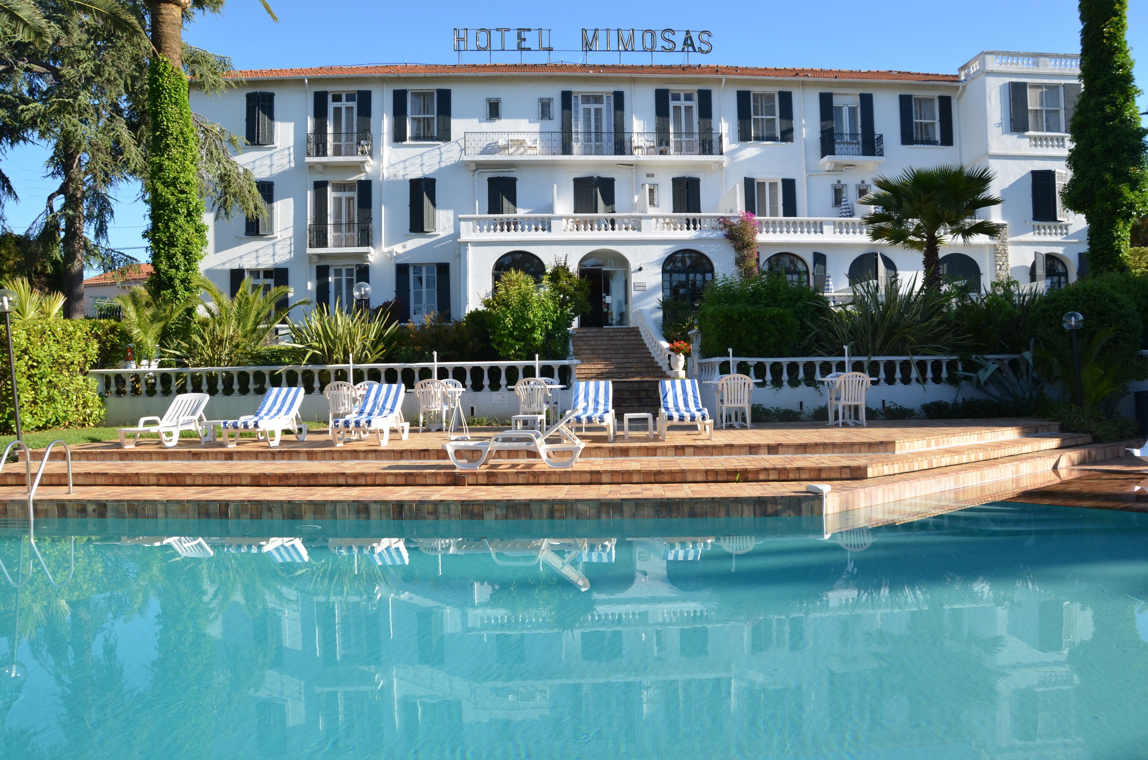 outdoor pool, open 8 am to 9 pm, pool umbrellas, pool loungers