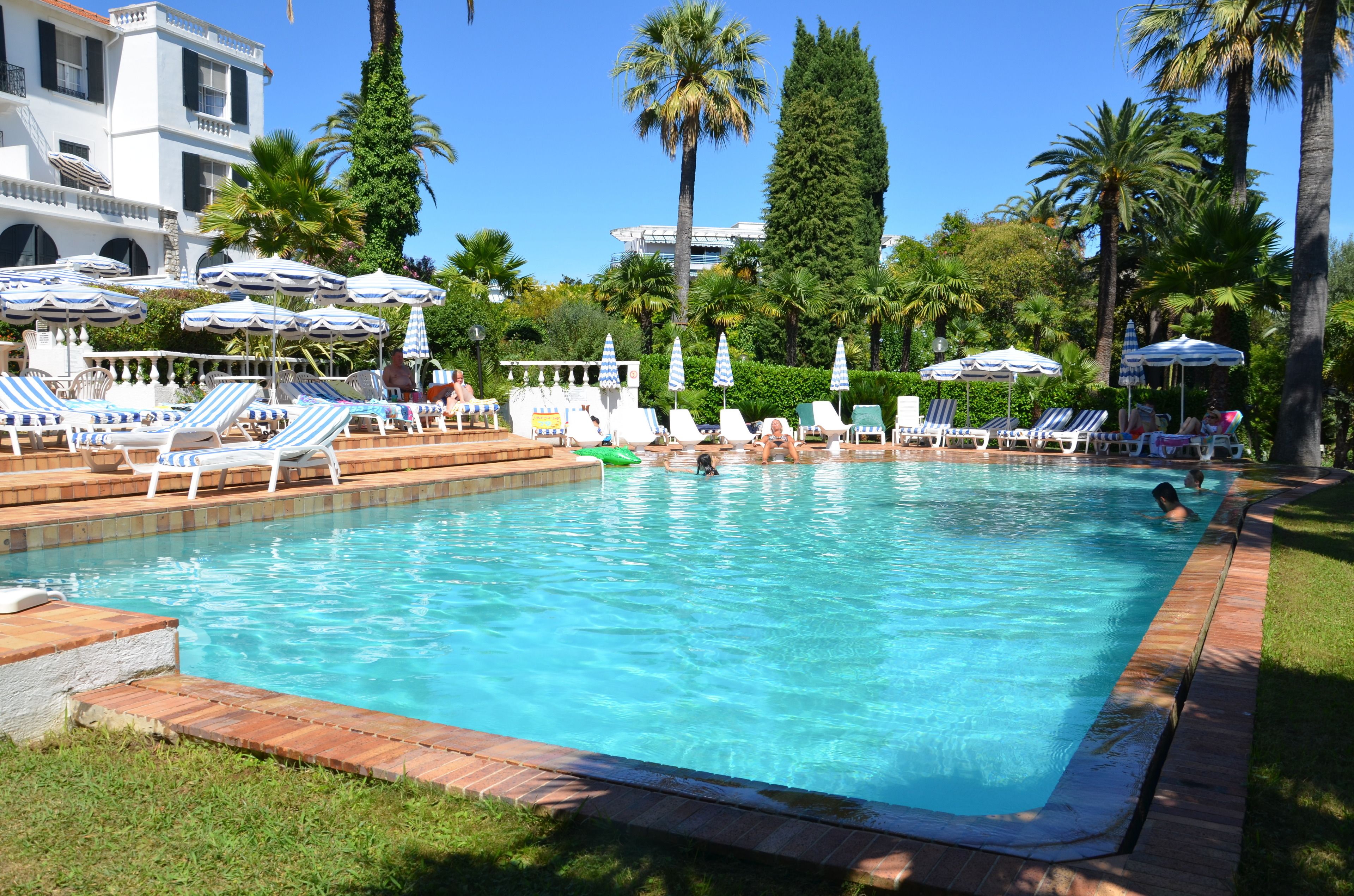 outdoor pool, open 8 am to 9 pm, pool umbrellas, pool loungers