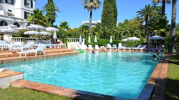 Outdoor pool, open 8 AM to 9 PM, pool umbrellas, pool loungers