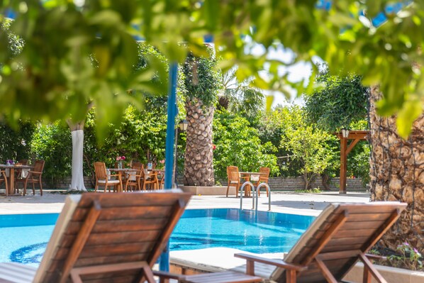 Outdoor pool, open 9:00 AM to 7:00 PM, pool umbrellas, sun loungers