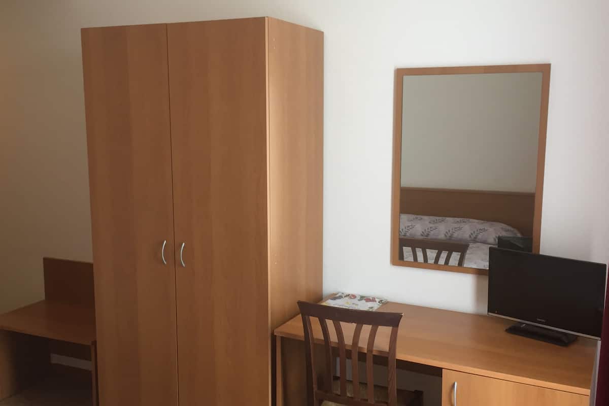 single room | in-room safe, desk, blackout curtains, iron/ironing board