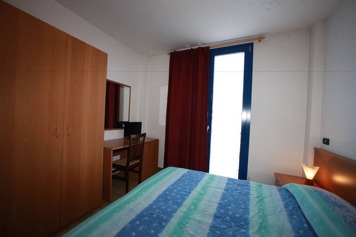 in-room safe, desk, blackout curtains, iron/ironing board