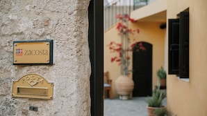 A building facade with a mailbox labeled "zacosta" and a door. - Zacosta Villa - a Heritage Hotel (Rhodes)