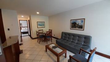 Superior Suite | Living area | 32-inch LCD TV with cable channels, TV