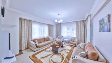 Villa, bain à remous, vue jardin (Dubleks) | Coin séjour | Télévision LCD, lecteur de DVD, table de tennis de table