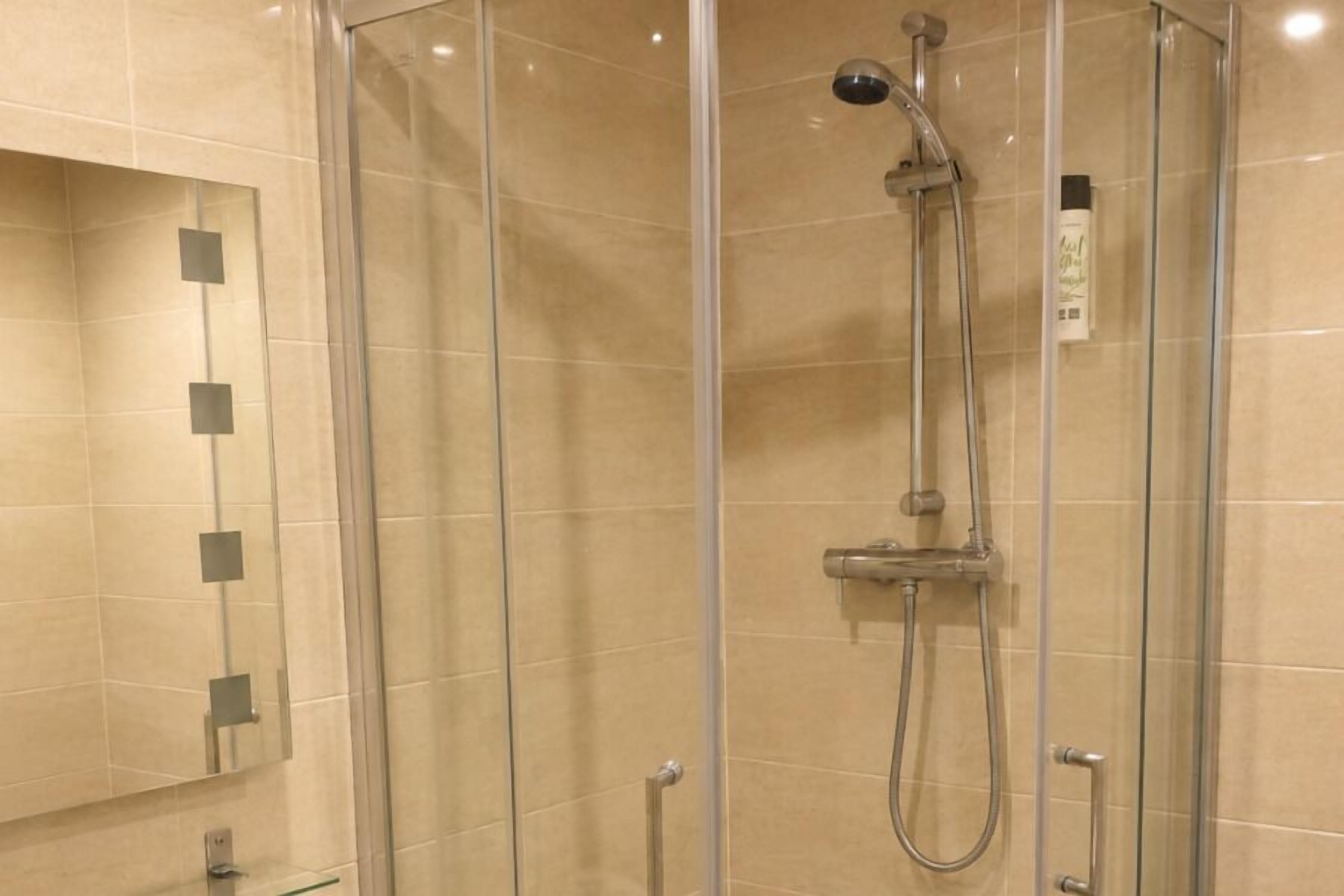 Shower, free toiletries, towels, toilet paper