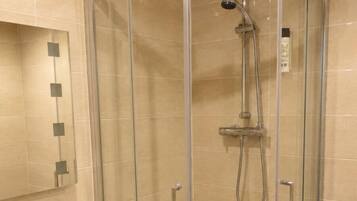 Shower, free toiletries, towels, toilet paper