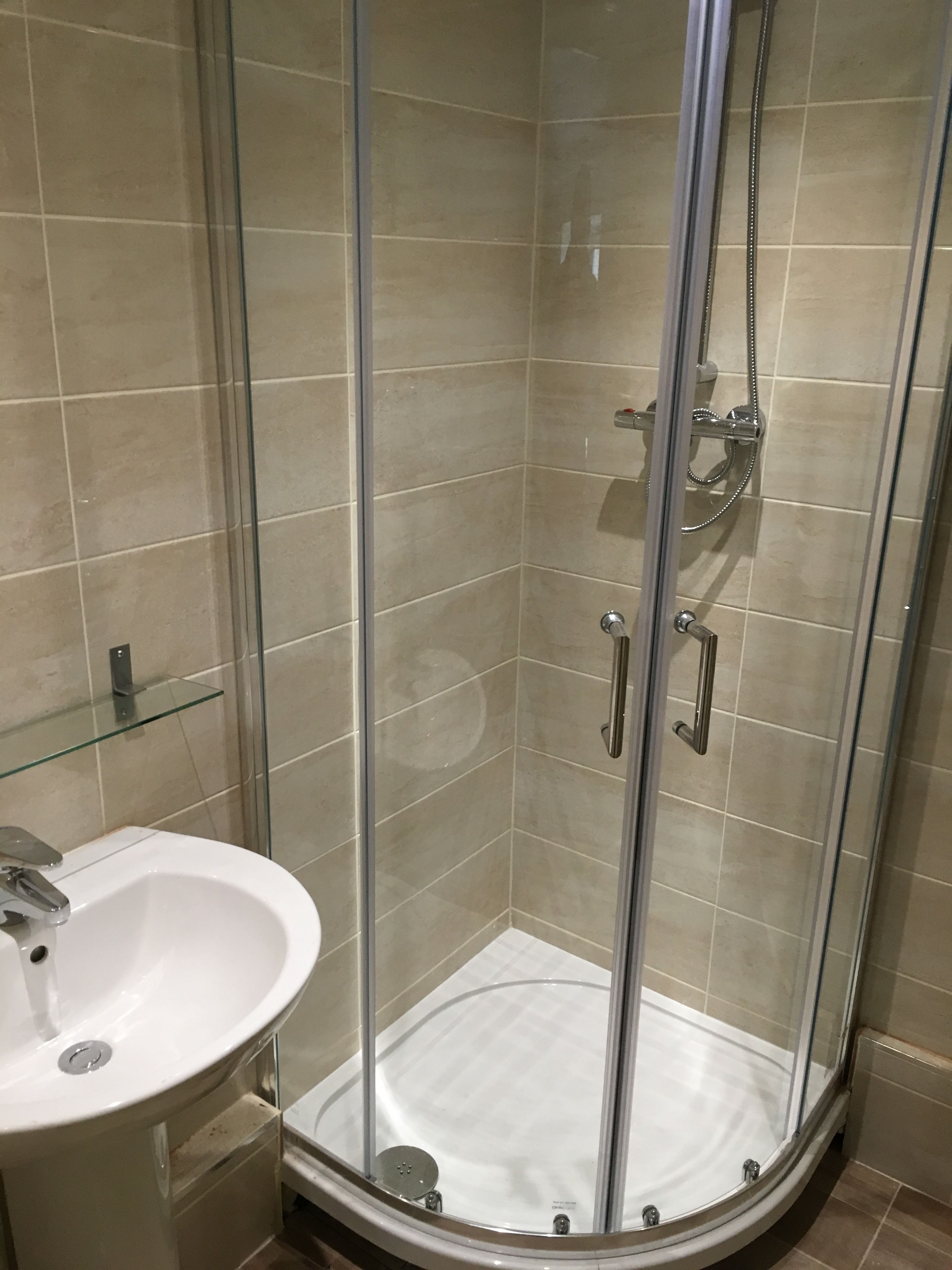 shower, free toiletries, towels, toilet paper