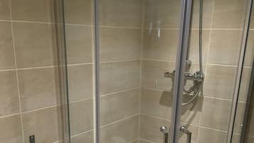 Shower, free toiletries, towels, toilet paper