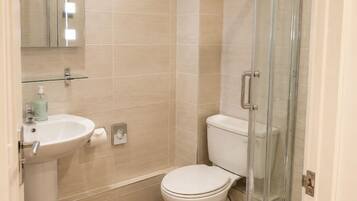 Shower, free toiletries, towels, toilet paper