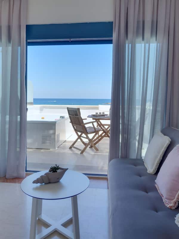 Junior Suite, 1 Queen Bed with Sofa bed, Hot Tub, Sea View | Living area | Flat-screen TV