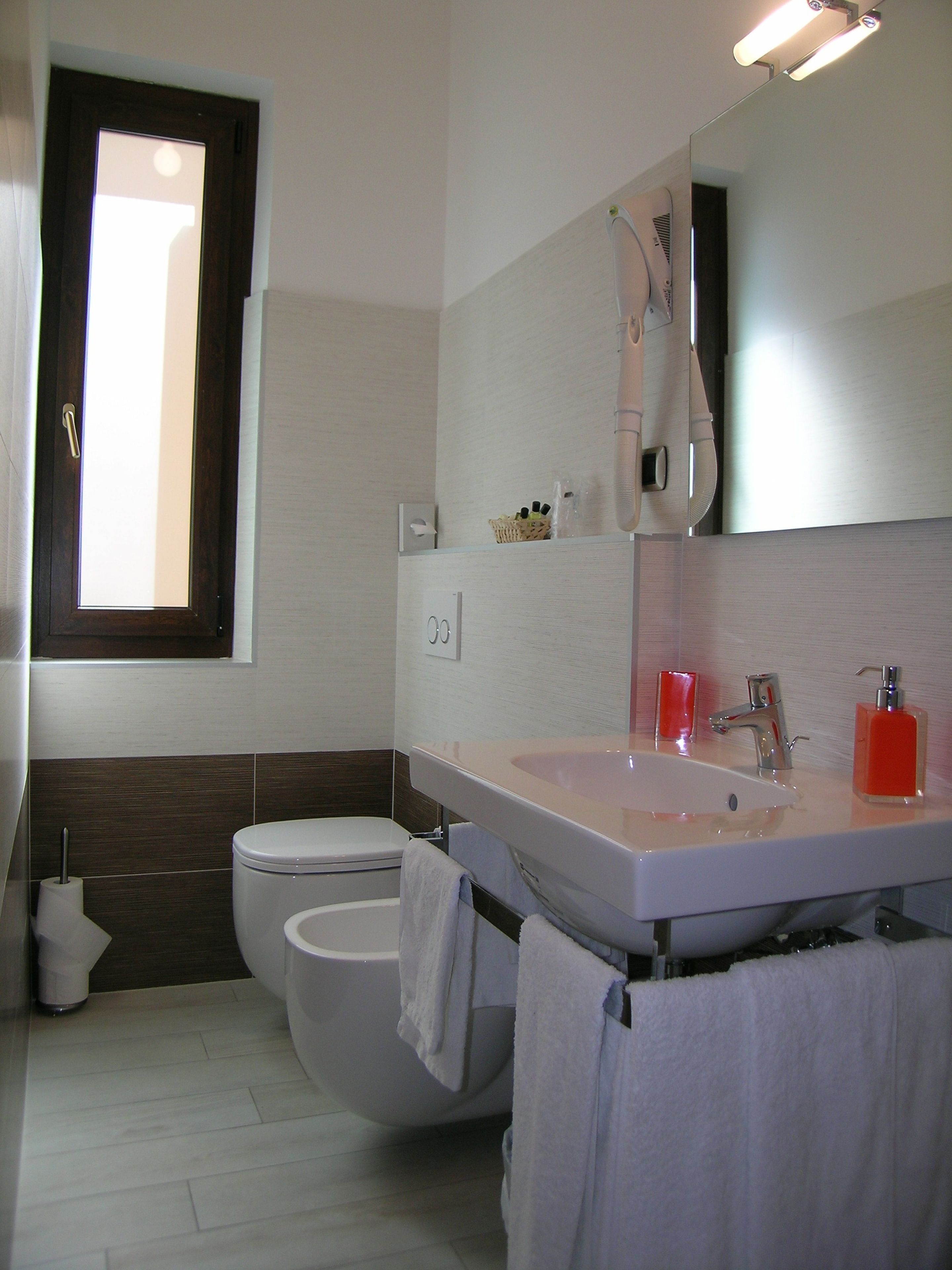 quadruple room | bathroom | rainfall showerhead, free toiletries, hair dryer, bidet